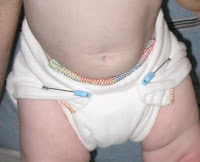 Image: prefold diaper fastened with plastic head diaper pins